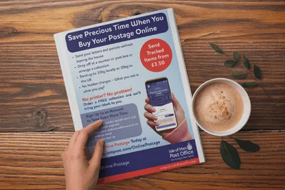Leaflet on a table with a coffee cup