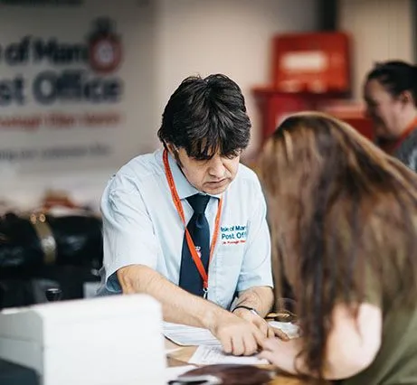 Counter clerk assisting customer